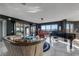 Bright living room with a piano, unique decor, and large windows offering stunning views and natural light at 3 Oceans West Blvd # 7C6, Daytona Beach Shores, FL 32118