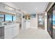 Bathroom with dual sinks, elegant cabinetry and lighting plus an ocean view at 3000 N Atlantic Ave # 11, Daytona Beach, FL 32118