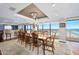 This dining room connects to an ocean view, kitchen island, and chandeliers at 3000 N Atlantic Ave # 11, Daytona Beach, FL 32118