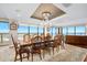 This is an airy dining room that features a chandelier and an ocean view at 3000 N Atlantic Ave # 11, Daytona Beach, FL 32118