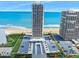 Aerial view of this beachfront high rise building with private parking and a beautiful view of the ocean at 3000 N Atlantic Ave # 11, Daytona Beach, FL 32118