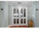 Hallway features a decorative glass doors and an elevator at 3000 N Atlantic Ave # 11, Daytona Beach, FL 32118