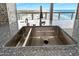 Kitchen sink overlooking ocean, and has nice countertops, faucet and backsplash at 3000 N Atlantic Ave # 11, Daytona Beach, FL 32118