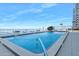 Oceanfront pool area with lounge chairs and tables for relaxing and enjoying the view at 3000 N Atlantic Ave # 11, Daytona Beach, FL 32118