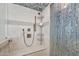 Modern shower features designer tile work, rainfall shower head, and built in seating at 3000 N Atlantic Ave # 11, Daytona Beach, FL 32118