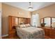 Cozy bedroom showcases a unique mirrored headboard and coordinated wooden furniture set at 3160 Bailey Ann Dr, Ormond Beach, FL 32174