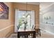 Cozy dining room with natural light, a modern chandelier, and stylish decor at 3160 Bailey Ann Dr, Ormond Beach, FL 32174