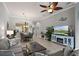 Open-concept living room featuring contemporary furniture, a ceiling fan, and seamless flow at 3160 Bailey Ann Dr, Ormond Beach, FL 32174