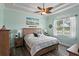 Serene main bedroom with a tray ceiling, neutral paint, and ample natural light at 3160 Bailey Ann Dr, Ormond Beach, FL 32174