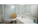 Bright bathroom featuring a shower-tub combo and a white vanity at 3641 S Atlantic Ave # 212, Daytona Beach Shores, FL 32118