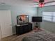 Charming bedroom features dark dresser and nightstand and a gray bedspread at 3641 S Atlantic Ave # 212, Daytona Beach Shores, FL 32118