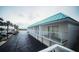 Exterior of building featuring garages and balconies on a cloudy day at 3641 S Atlantic Ave # 212, Daytona Beach Shores, FL 32118