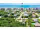 Aerial view of lush landscaping, pool, and beachside condos against the ocean backdrop at 4555 S Atlantic Ave # 4708, Port Orange, FL 32127