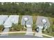 Aerial view of a well manicured single Gathering home with neutral color palette, mature landscaping and a two car driveway at 1068 Sea Shell Ct, Daytona Beach, FL 32124