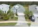 Overhead view of a home featuring a stylish roof and a pristine driveway, blending comfort and sophistication at 1068 Sea Shell Ct, Daytona Beach, FL 32124