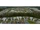 Aerial view of a vast residential community featuring a mix of housing styles and lush landscaping at 1068 Sea Shell Ct, Daytona Beach, FL 32124