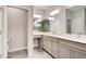 Bathroom featuring double sinks, a large mirror, a toilet, and tiled floor at 1068 Sea Shell Ct, Daytona Beach, FL 32124