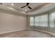 Bright bedroom featuring a ceiling fan, wood-look tile floors, and a large bay window at 1068 Sea Shell Ct, Daytona Beach, FL 32124