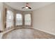 Bedroom showcasing tiled floor, and large bay windows with floral coverings at 1068 Sea Shell Ct, Daytona Beach, FL 32124