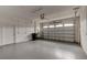 Spacious garage features concrete floor, white walls, and automatic door at 1068 Sea Shell Ct, Daytona Beach, FL 32124