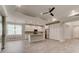 Bright kitchen with white cabinetry, granite countertops, stainless steel appliances, and tile flooring at 1068 Sea Shell Ct, Daytona Beach, FL 32124