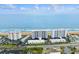 Aerial view of beachfront condominiums, blue ocean waters, and surrounding landscape at 1155 Ocean Shore Blvd # 507, Ormond Beach, FL 32176