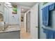 Well-lit bathroom featuring a granite countertop and colorful ocean-themed artwork at 1155 Ocean Shore Blvd # 507, Ormond Beach, FL 32176