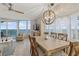 Dining area with a wooden table set, modern lighting, ocean views at 1155 Ocean Shore Blvd # 507, Ormond Beach, FL 32176