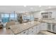 An open kitchen flows into the dining area with ocean view at 1155 Ocean Shore Blvd # 507, Ormond Beach, FL 32176