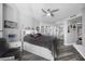 Well decorated bedroom featuring a waterfront view, a ceiling fan, and hardwood floors at 231 Riverside Dr # 1907-1, Holly Hill, FL 32117