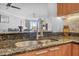 Close up of kitchen area that features granite countertop and decorative faucet at 231 Riverside Dr # 1907-1, Holly Hill, FL 32117