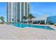 Beautiful outdoor swimming pool in a resort setting, with a high-rise in the background at 231 Riverside Dr # 1907-1, Holly Hill, FL 32117