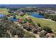 Beautiful aerial view of a house with golf course in the backyard at 5 Captiva At Lionspaw, Daytona Beach, FL 32124