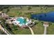 Aerial view of the pool area, lush landscaping, and golf course at 5 Captiva At Lionspaw, Daytona Beach, FL 32124