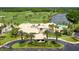 Aerial view of a luxury home with a pool, surrounded by a golf course and lush landscaping at 5 Captiva At Lionspaw, Daytona Beach, FL 32124