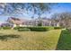 Landscaped backyard featuring a screened-in pool and covered lanai, perfect for outdoor entertaining at 5 Captiva At Lionspaw, Daytona Beach, FL 32124