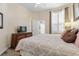 Bedroom with a ceiling fan and shutters at 5 Captiva At Lionspaw, Daytona Beach, FL 32124