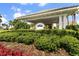 Inviting clubhouse entrance featuring manicured landscaping and a covered entryway at 5 Captiva At Lionspaw, Daytona Beach, FL 32124