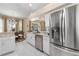 A view of the kitchen with white cabinetry, stainless steel appliances, and granite countertops at 5 Captiva At Lionspaw, Daytona Beach, FL 32124