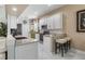 A well lit kitchen with stainless steel appliances and granite countertops with breakfast bar and seating at 5 Captiva At Lionspaw, Daytona Beach, FL 32124