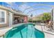 Beautiful screened pool and spa area with outdoor dining, seating area and lush landscaping at 5 Captiva At Lionspaw, Daytona Beach, FL 32124