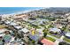 Scenic aerial view of the charming neighborhood and nearby beach, offering the perfect blend of community and waterfront living at 11 Briggs Dr, Ormond Beach, FL 32176