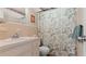 Charming bathroom features a white vanity and a shower with a decorative floral border at 11 Briggs Dr, Ormond Beach, FL 32176