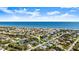 Stunning aerial of a coastal neighborhood near the ocean and river, highlighting the subject property at 111 Heron Dunes Dr, Ormond Beach, FL 32176