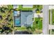 Bird's-eye view showcasing a private pool, tidy landscaping, and a storage shed, all in a well-maintained yard at 111 Heron Dunes Dr, Ormond Beach, FL 32176