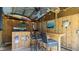 Outdoor tiki bar with seating, wood counter, ceiling fan, and various nautical decorations at 111 Heron Dunes Dr, Ormond Beach, FL 32176