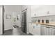 Clean white kitchen with modern stainless steel appliances and granite countertops at 111 Heron Dunes Dr, Ormond Beach, FL 32176
