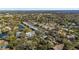 Expansive aerial view of a community showcasing the beautiful pond and lush green landscape at 128 Pine Cone Trl, Ormond Beach, FL 32174