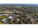 Overhead shot displaying a quiet residential area surrounded by dense, leafy trees at 128 Pine Cone Trl, Ormond Beach, FL 32174