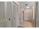 Full bathroom with a stall shower and louvered closet doors at 128 Pine Cone Trl, Ormond Beach, FL 32174